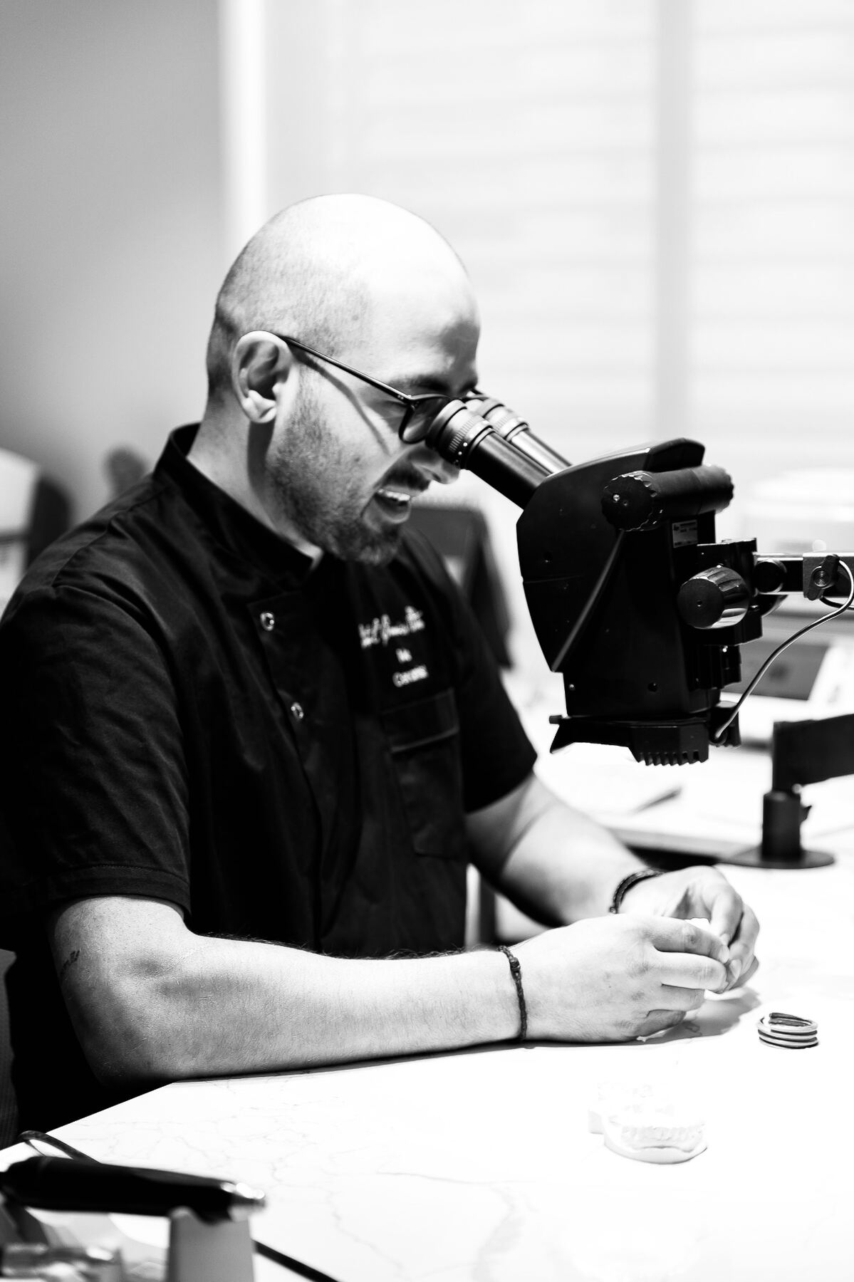 Mo at the bench, working under the microscope